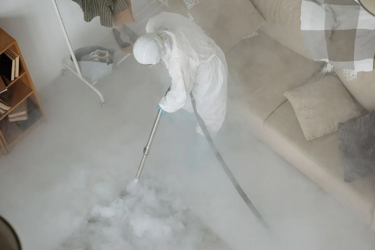 Biohazard cleanup technician in protective equipment, Cave Springs, AR
